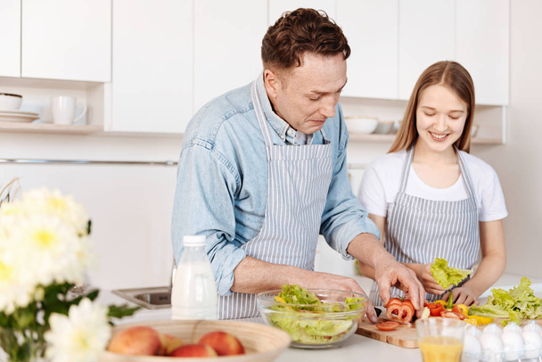 Joyful smiling father cooking with his daughter - Fotoğraf, Görsel