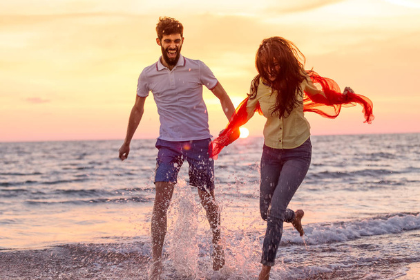 Couple holding hands on beach  - Φωτογραφία, εικόνα