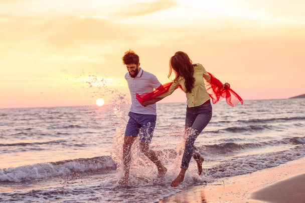 Couple have fun on beach  - Фото, изображение
