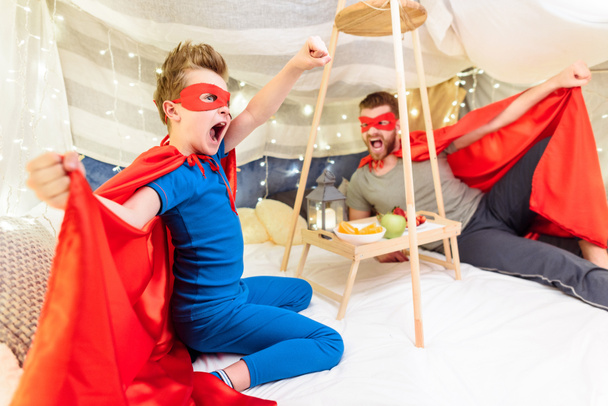 Father and son in superhero costumes  - 写真・画像
