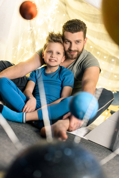 father and son in blanket fort  - Foto, Bild