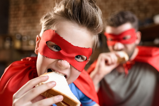 father and son eating sandwiches - Photo, Image
