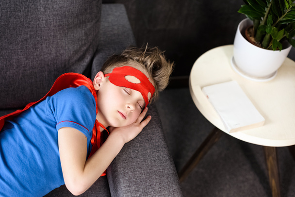 boy in superhero costume sleeping  - Photo, Image