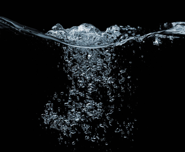 Water on a black - Foto, afbeelding