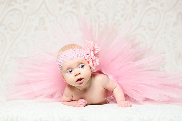 cute little baby girl in a nice pink flared dress - Photo, Image