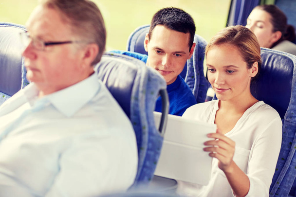 happy couple with tablet pc in travel bus - Фото, зображення