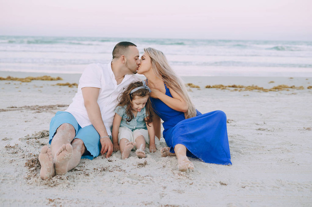 beautiful family on the beach - Фото, зображення