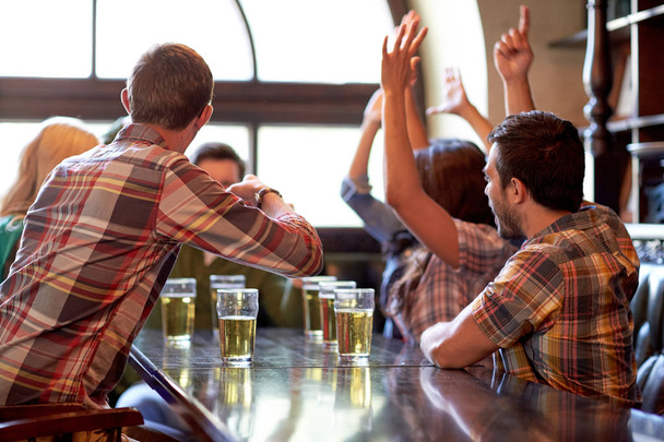 football fans or friends with beer at sport bar - Фото, зображення