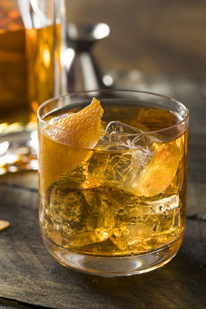 Boozy Homemade Old Fashioned Bourbon on the Rocks - Фото, изображение