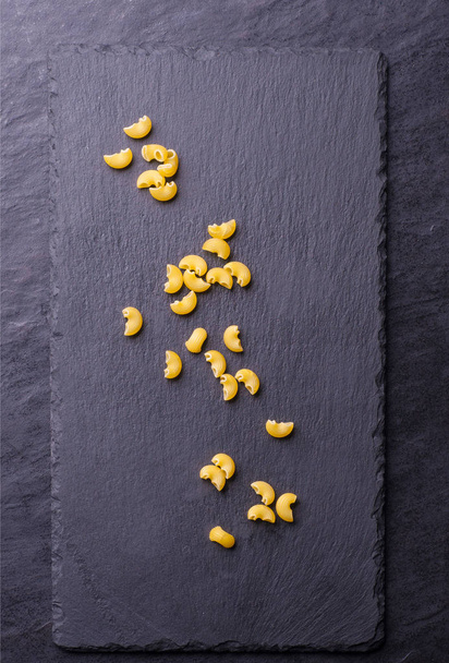 raw pasta on a board - Foto, Imagem