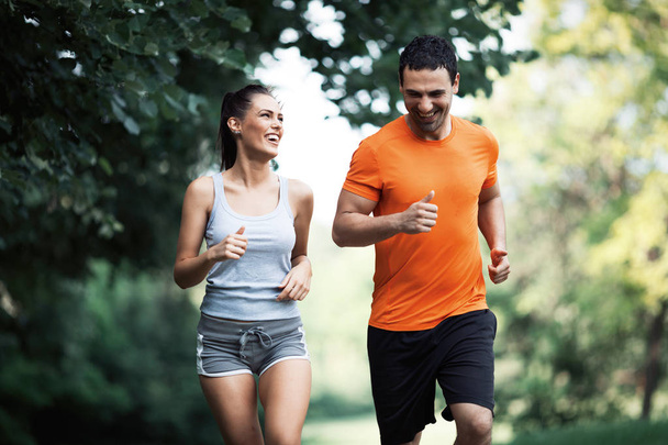 Happy couple running together - Photo, Image