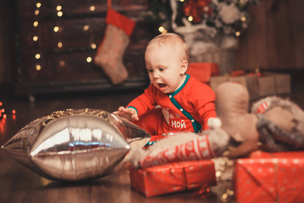 Lovely Baby boy in Santa Claus costume for Christmas playing wit - Photo, Image