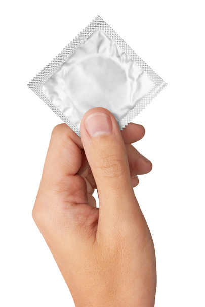 Condom in hand - Foto, imagen