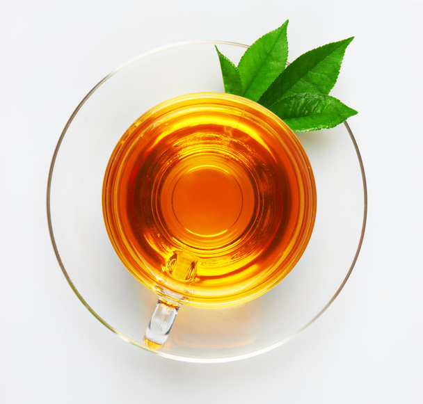 kubek z herbaty i zielony liść - Zdjęcie, obraz