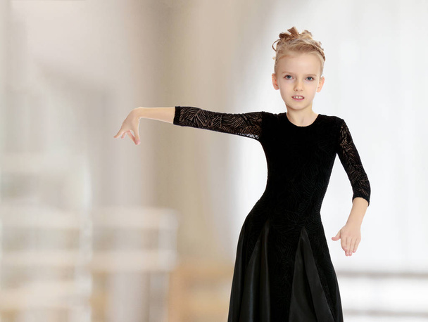 Beautiful little dancer in a black dress. - Foto, immagini