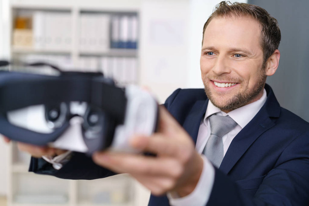 Businessman with virtual reality glasses - 写真・画像