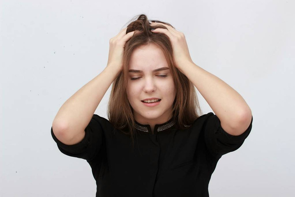 Young woman has headache, isolated on gray background - Foto, Imagem