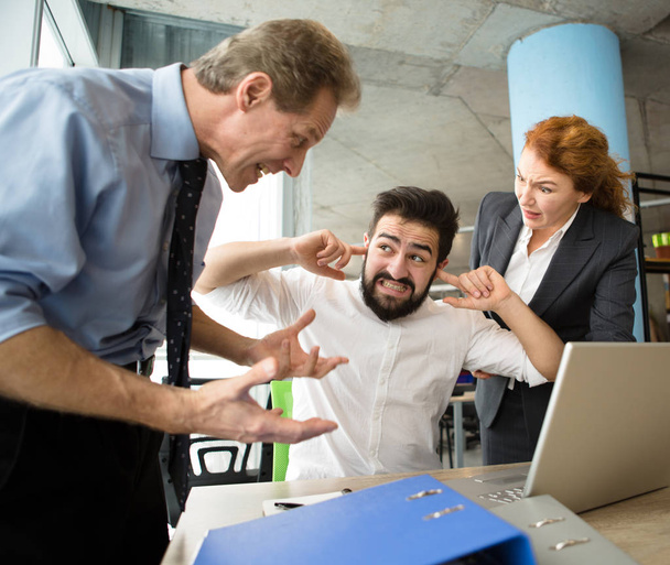 Angry boss screaming at workers - 写真・画像