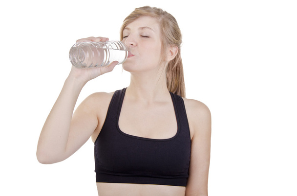 Sporty woman drinking water - Foto, Imagen