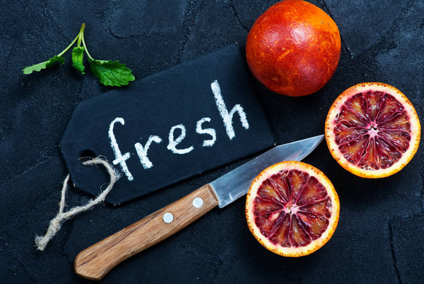 citrus fruit on a table and word fresh  - Foto, imagen