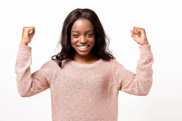 Exuberant young African woman cheering - Photo, Image