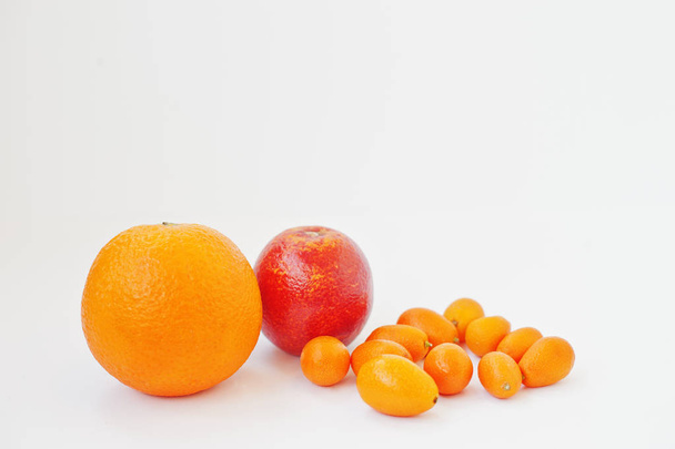 Exotic fruits kumquat with orange and blood (sicilian) orange is - Φωτογραφία, εικόνα
