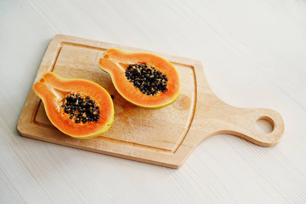 Exotic fruit papaya or papaw isolated on white background on woo - Фото, зображення
