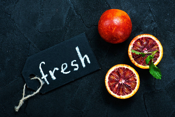 citrus fruit on a table and word fresh  - Foto, Bild