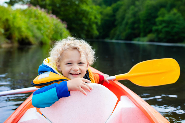 Little boy in kayak - Foto, imagen