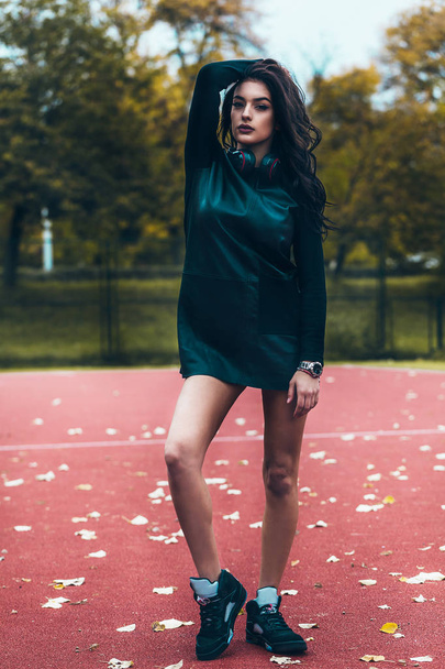 young woman posing at basketball court - Valokuva, kuva