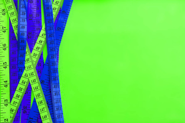 Diet control concept background. Colorful of Measuring tape on v - Photo, Image