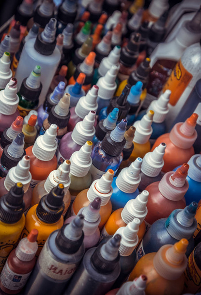 professional colorful ink in bottles to create tattoos . - Foto, Imagem