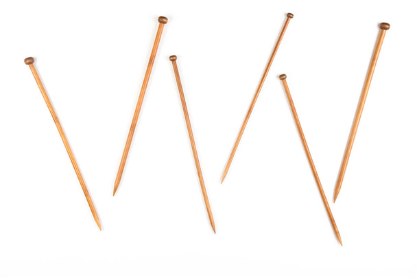 Variety of bamboo knitting needles in different sizes on white background - Photo, Image