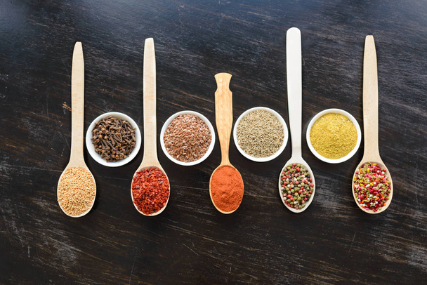 Various spices on wooden spoons - Foto, Imagen