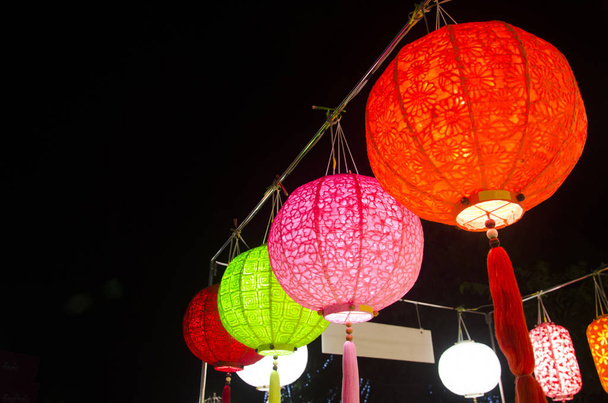 Hanging variety of colorful paper lamp and lantern lighting equi - Photo, Image