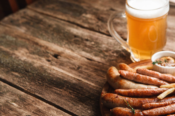 Grill sausages mix with beer, free space on wood - Foto, immagini