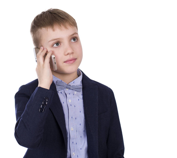 Portrait of a young boy with his new cell phone  - Foto, afbeelding