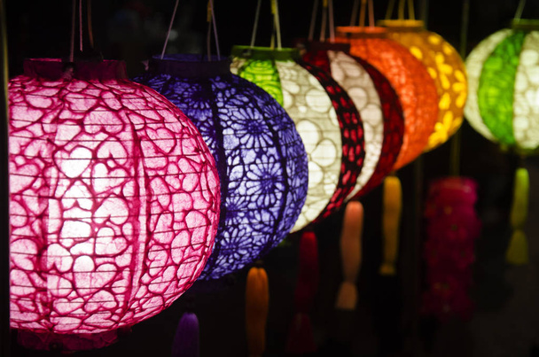 Hanging variety of colorful paper lamp and lantern lighting equi - Photo, Image