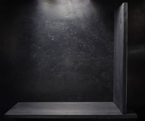 wooden shelf at black wall  - Photo, Image