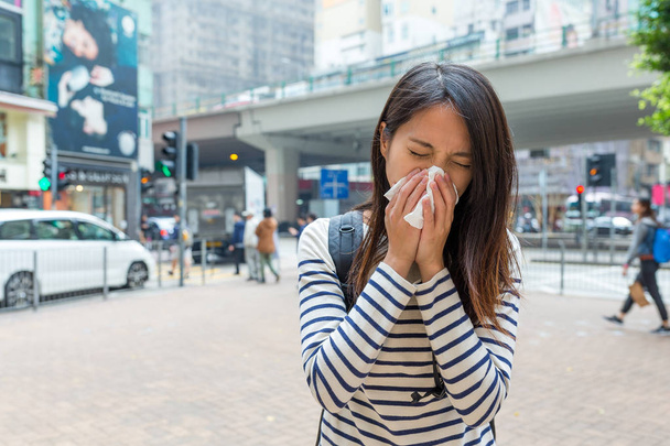 Woman suffer from sneezing at outdoor  - Photo, Image