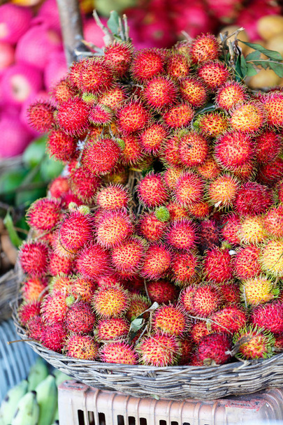 Rambutan fruits on market stall - Fotó, kép