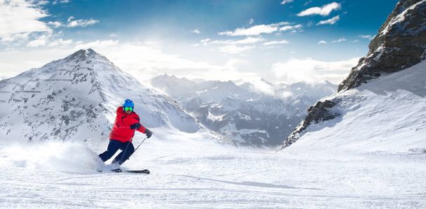 Man skiing on prepared slopes in Alps - Photo, Image
