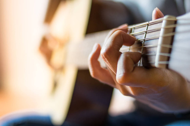 close up hand girl playing the guitar - 写真・画像
