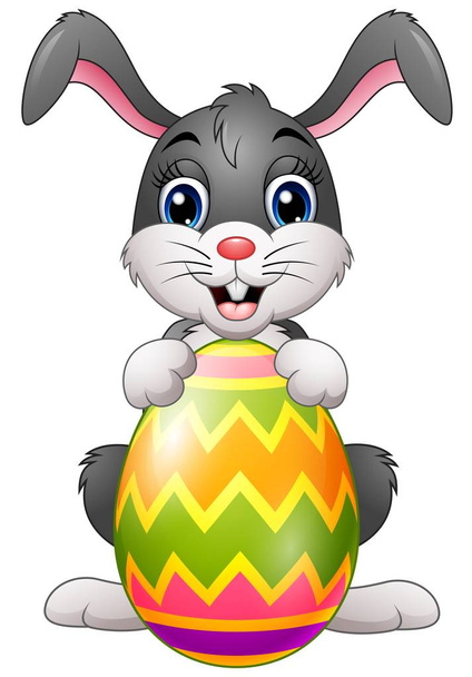 Cartoon bunny holding Easter egg - Vector, Image