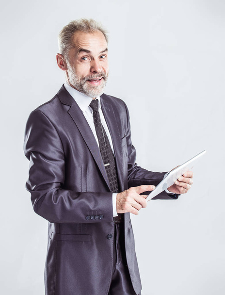 successful businessman with digital tablet on light background - Foto, afbeelding