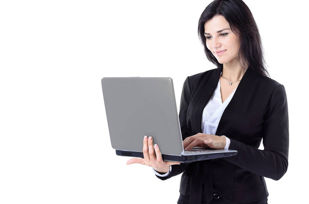 Businesswoman working at a laptop full length isolated, white background - Foto, Imagem