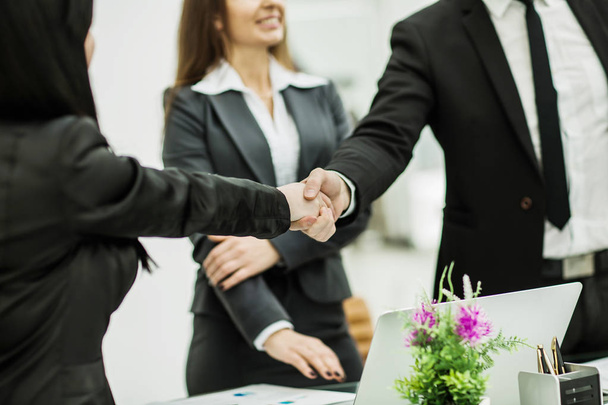 handshake successful business partners in the workplace in the o - Foto, imagen