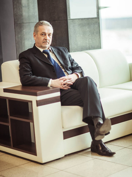 successful businessman sitting in chair modern office - Фото, зображення