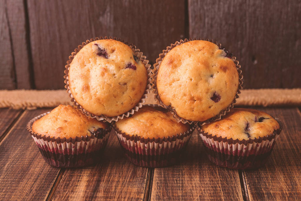 Muffins on wooden background on rustic style - Photo, Image