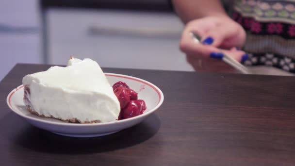 Girl adds cherries to cheese cake - Felvétel, videó